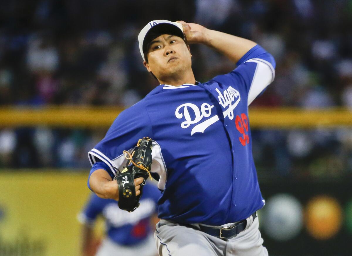 Dodgers pitcher Hyun-Jin Ryu throws against the Padres during a spring training game in 2015.