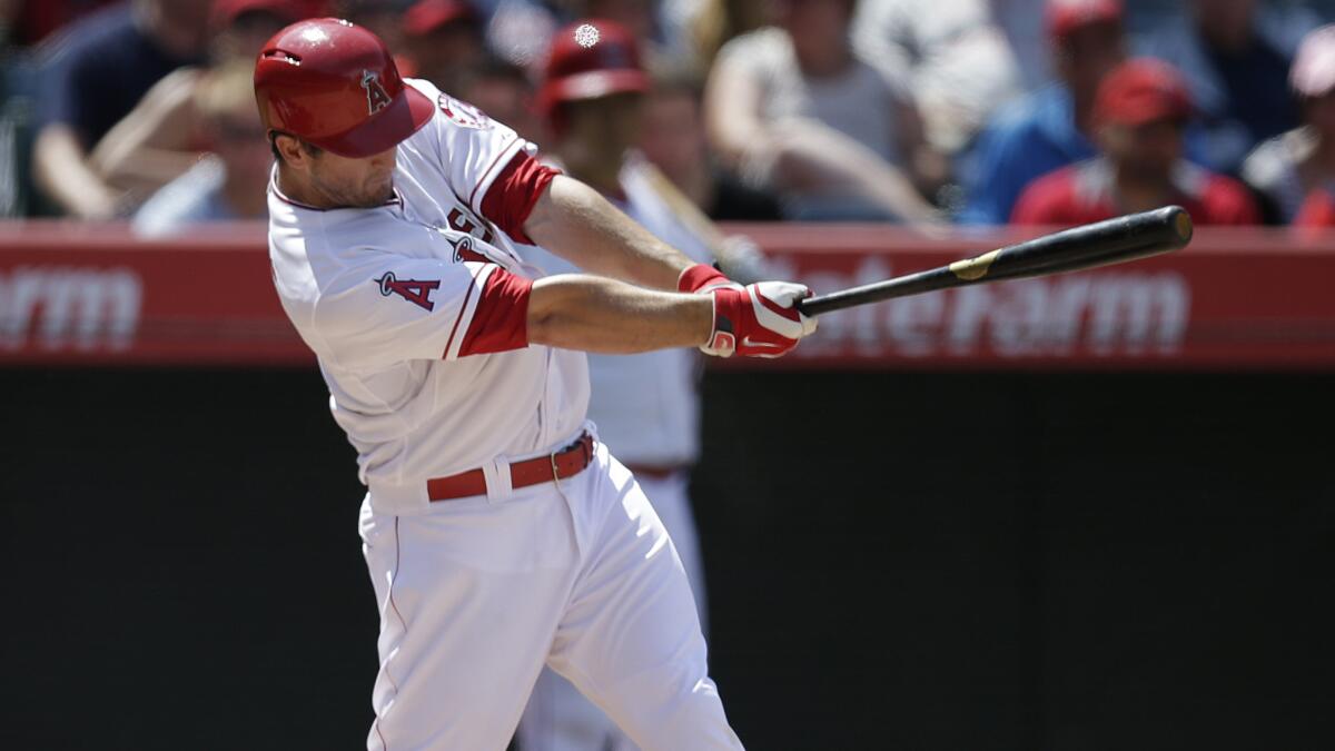 Angels third baseman David Freese hits a home run during the eighth inning of the team's 2-1 win over the Detroit Tigers on Sunday.