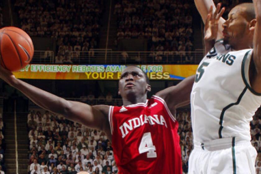 Indiana's Victor Oladipo drives to the basket against Michigan State's Adreian Payne during the Hoosiers' 72-68 victory.