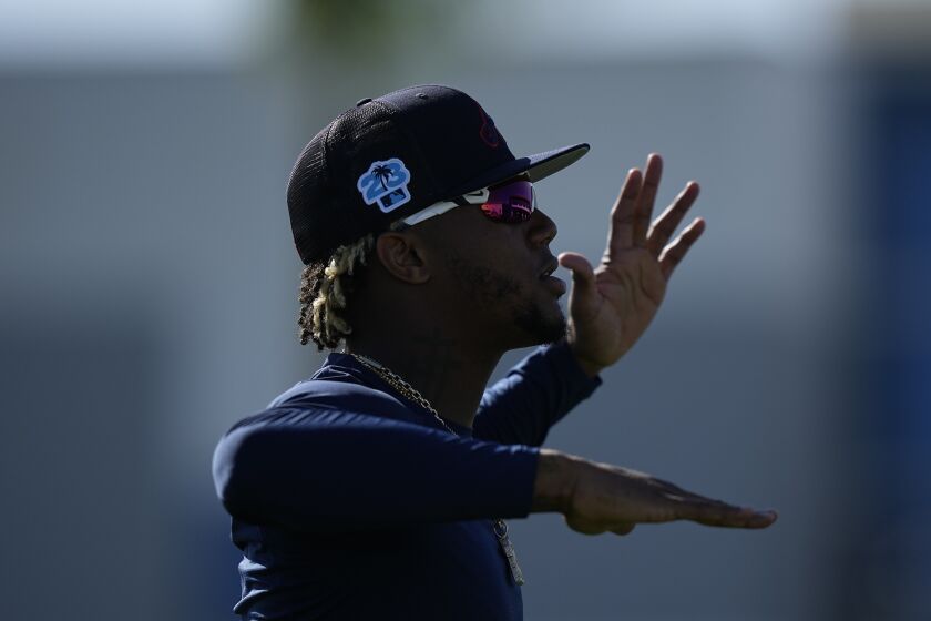 Atlanta Braves right fielder Ronald Acuna Jr. works out during a spring training baseball practice on Thursday, Feb. 16, 2023, in North Port, Fla. (AP Photo/Brynn Anderson)