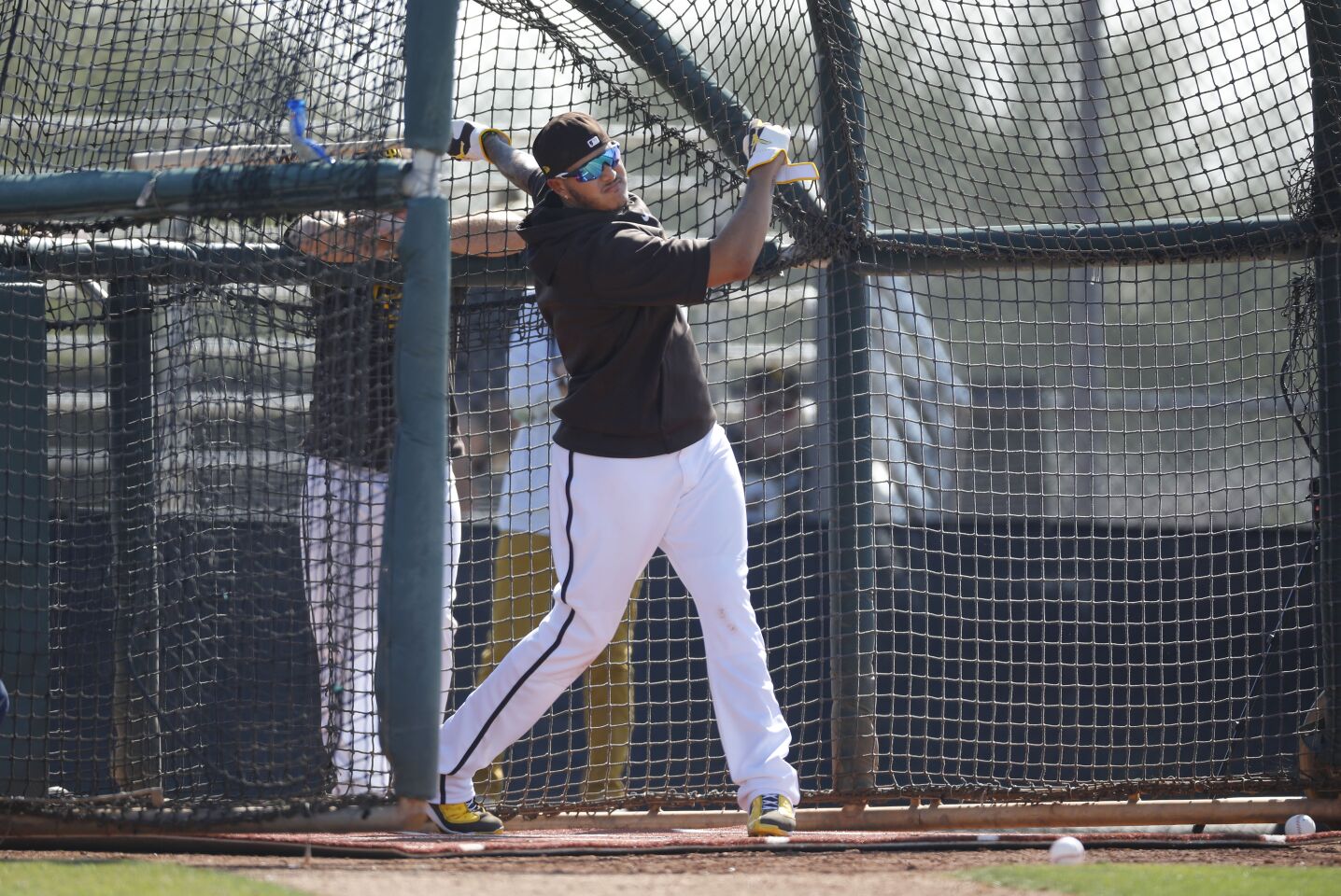 San Diego Padres Manny Machado bats during a spring training practice on Feb. 18, 2020.