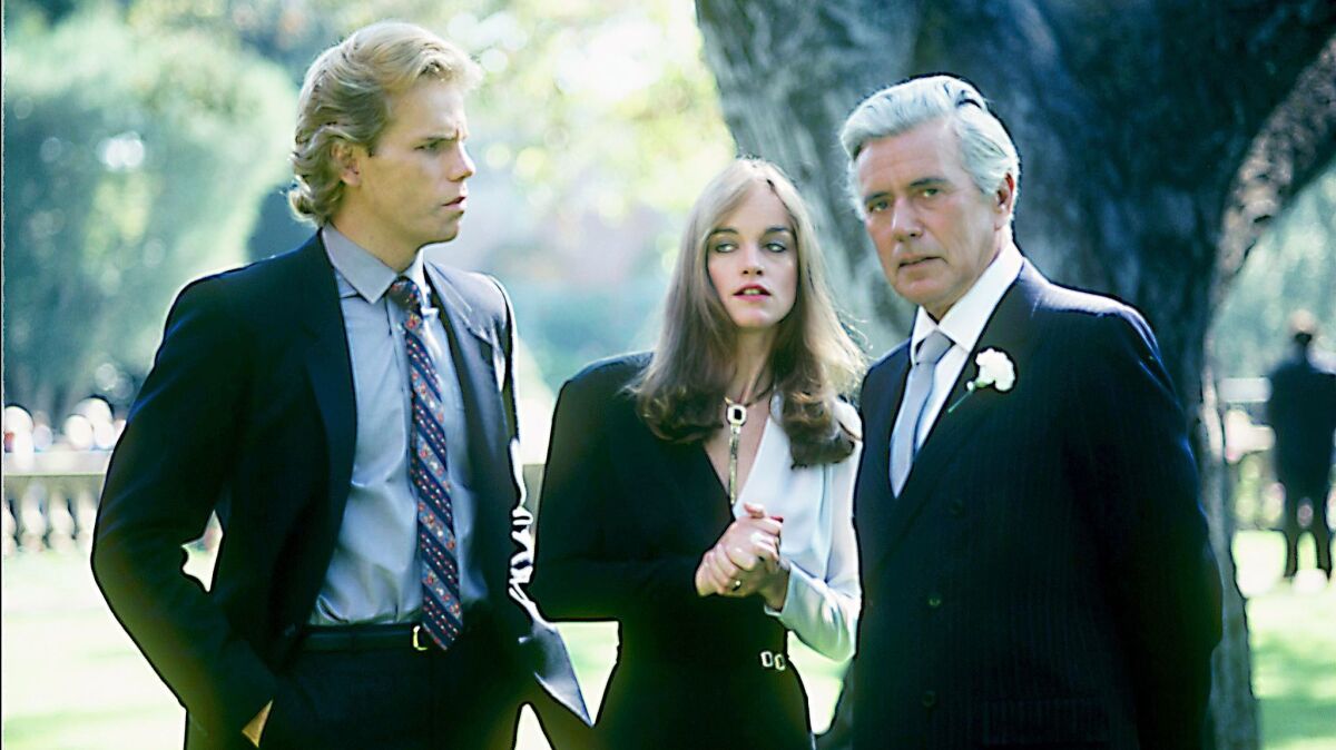 Al Corley, Pamela Sue Martin and John Forsythe in a scene from the 1981 "Dynasty" pilot. (ABC Photo Archives / ABC via Getty Images)