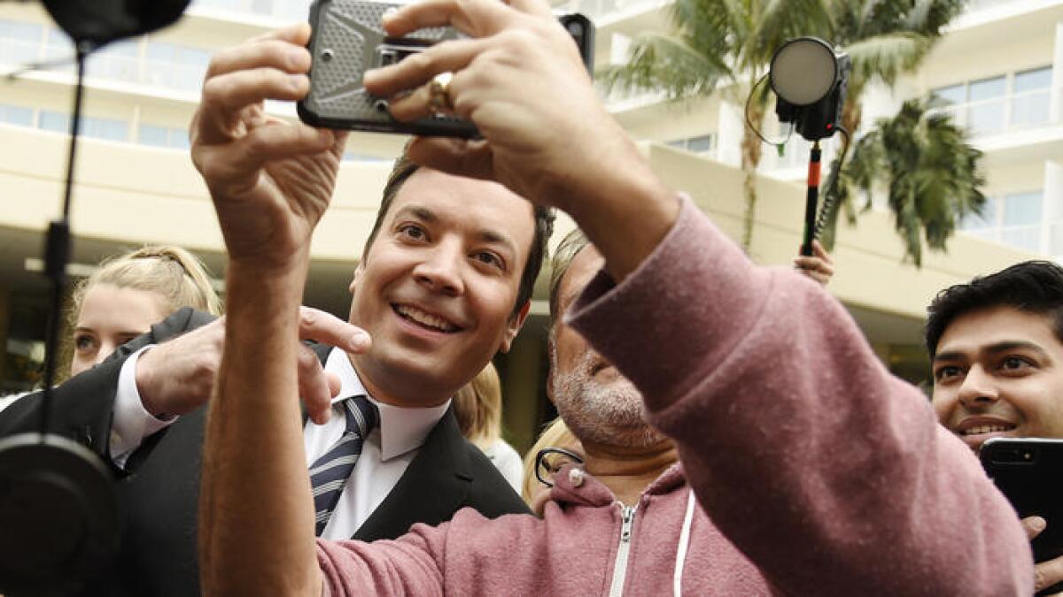 Jimmy Fallon poses for a selfie at the 2017 Golden Globe Awards preview day at the Beverly Hilton.