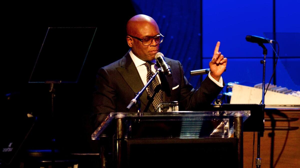 Antonio "L.A." Reid accepts an award at Clive Davis and the Recording Academy's 2013 Grammy Salute to Industry Icons Gala in 2013.