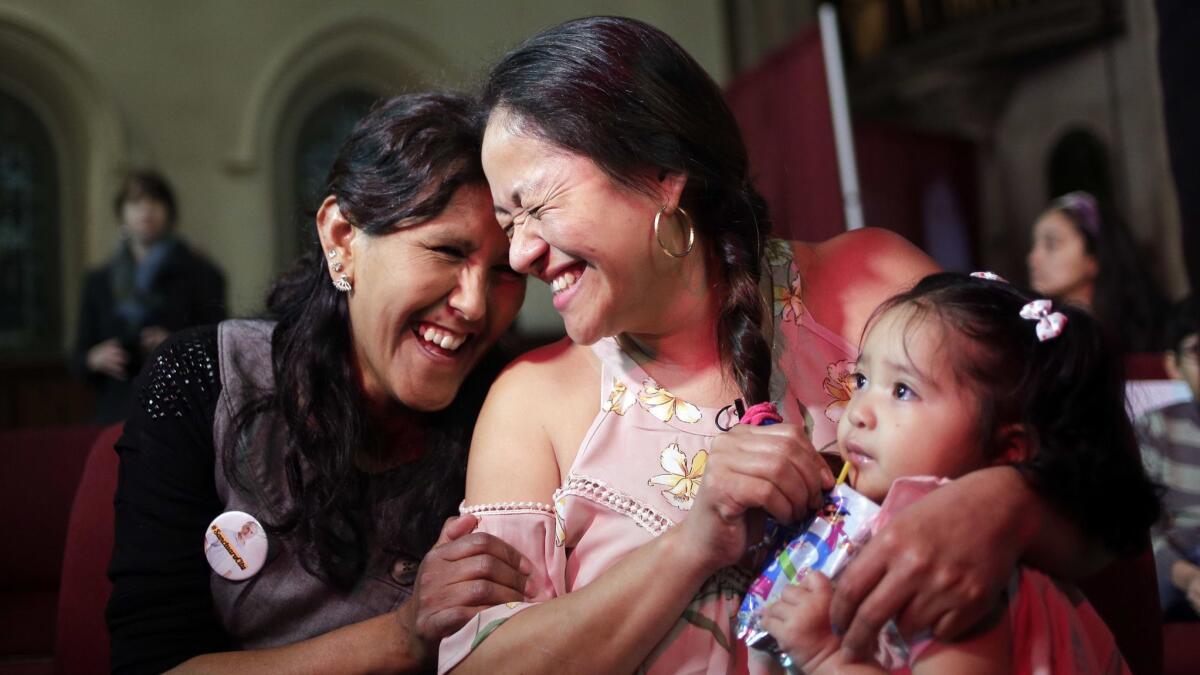 Undocumented immigrant Aura Hernandez, center, is being provided sanctuary by the Fourth Universalist Society church in New York.