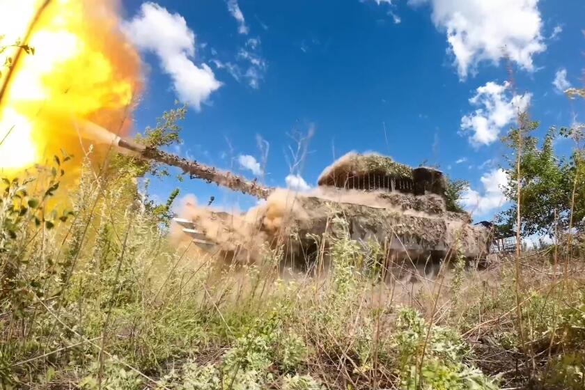 FILE -In this photo taken from video released by the Russian Defense Ministry on July 10, 2024, Russian tank T-80 of the grouping of troops "Center" fires towards Avdiivka direction from an undisclosed location. (Russian Defense Ministry Press Service photo via AP, File)