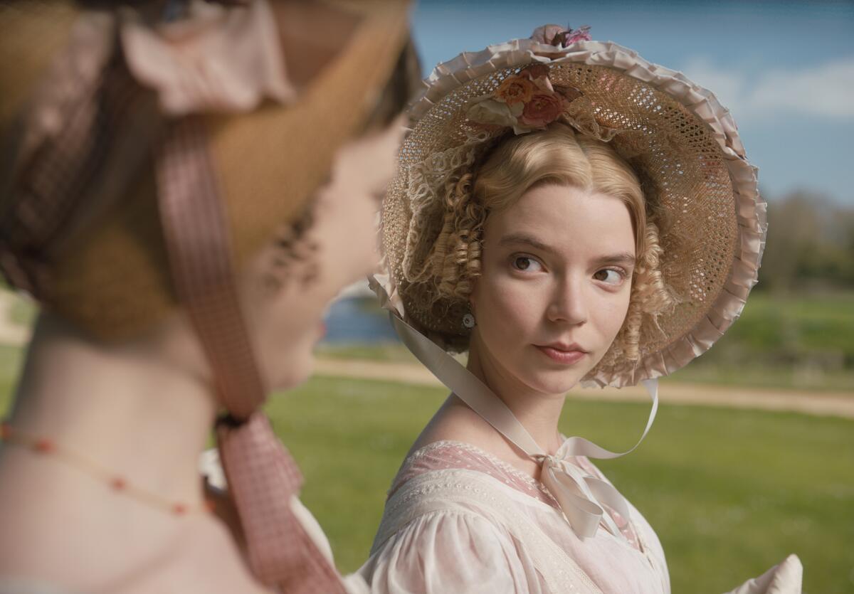 Anya Taylor-Joy wearing a white dress and bonnet in "Emma."