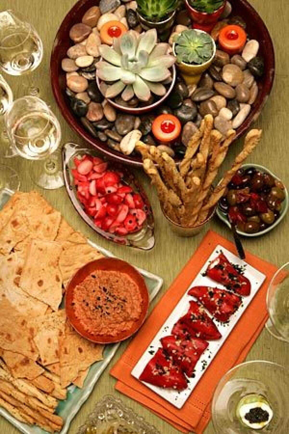 These easy-to-prepare appetizers require little or no oven time, yet go a long way toward making Thanksgiving dinner special. They include quick-pickled radishes, lavash crackers and muhammara, stuffed piquillo peppers and home-cured olives.