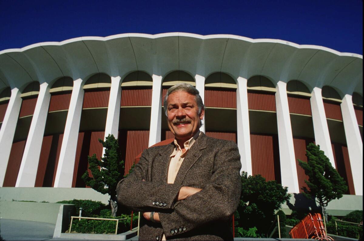 Lakers owner Jerry Buss stands outside the Forum in 1990.