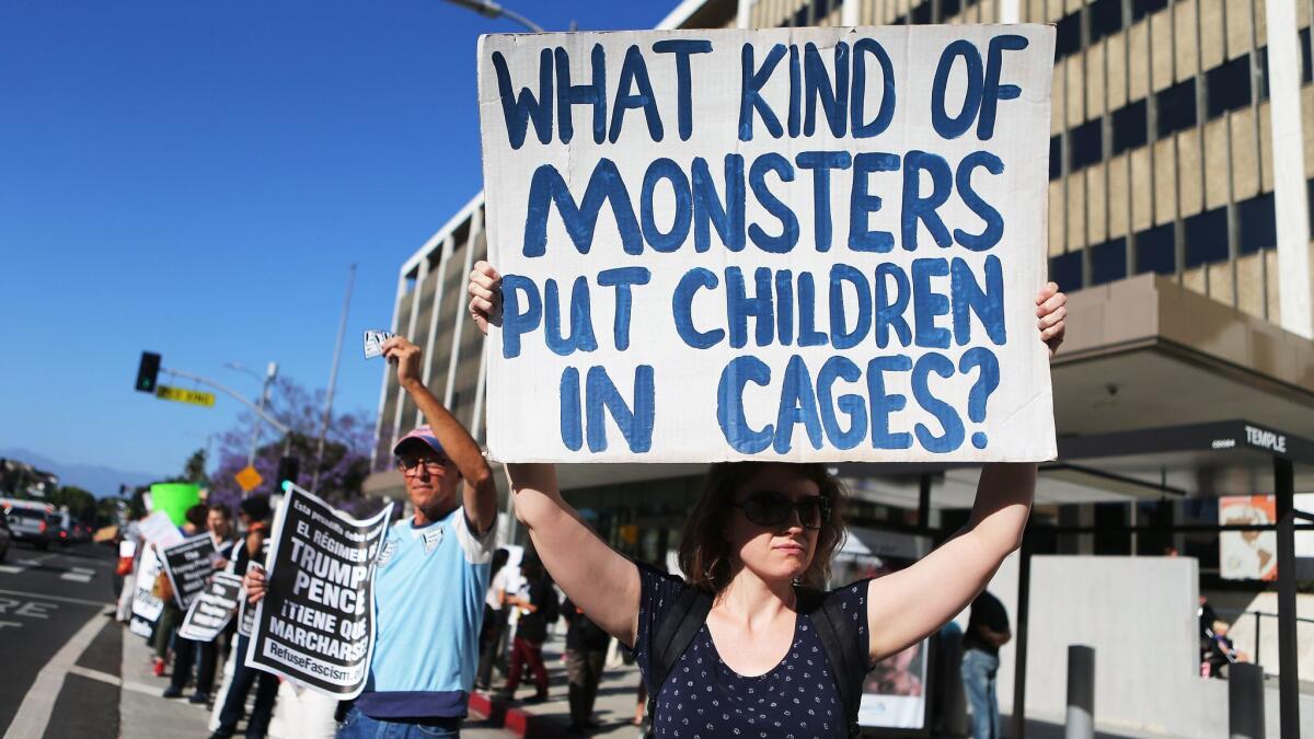 Protestors demonstrate against the separation of migrant children from their families in front of the Federal Building on June 18 in Los Angeles.