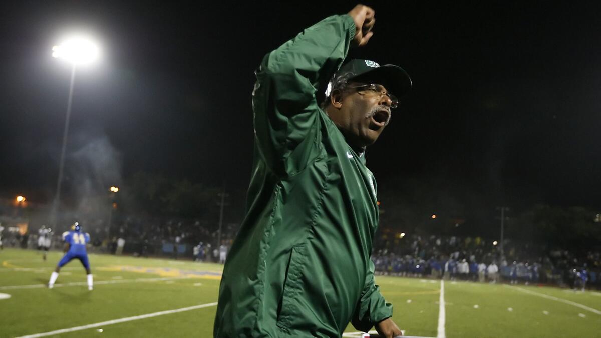 Dorsey coach Paul Knox, in a rare display of emotion, fires up the crowd before a game against rival Crenshaw in 2009.
