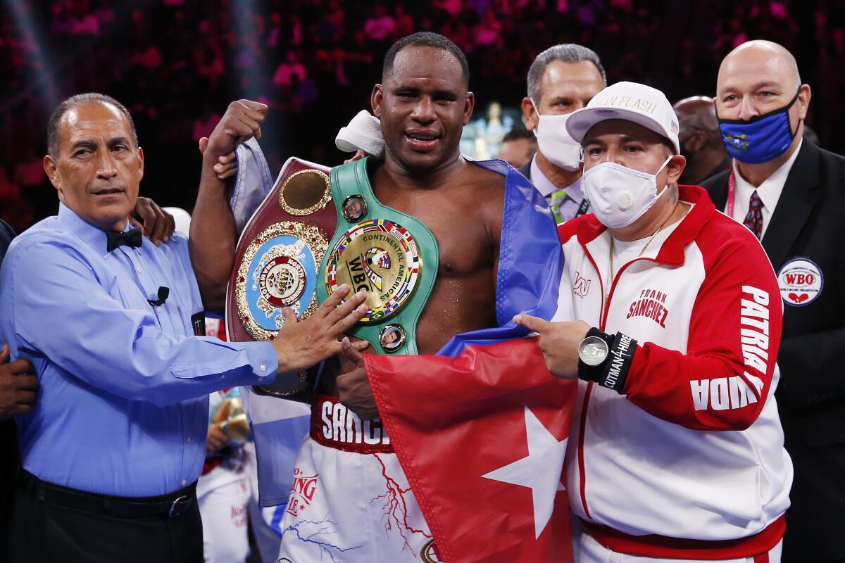 Frank Sánchez, of Cuba, celebrates after defeating Efe Ajagba, of Nigeria, by unanimous decision 