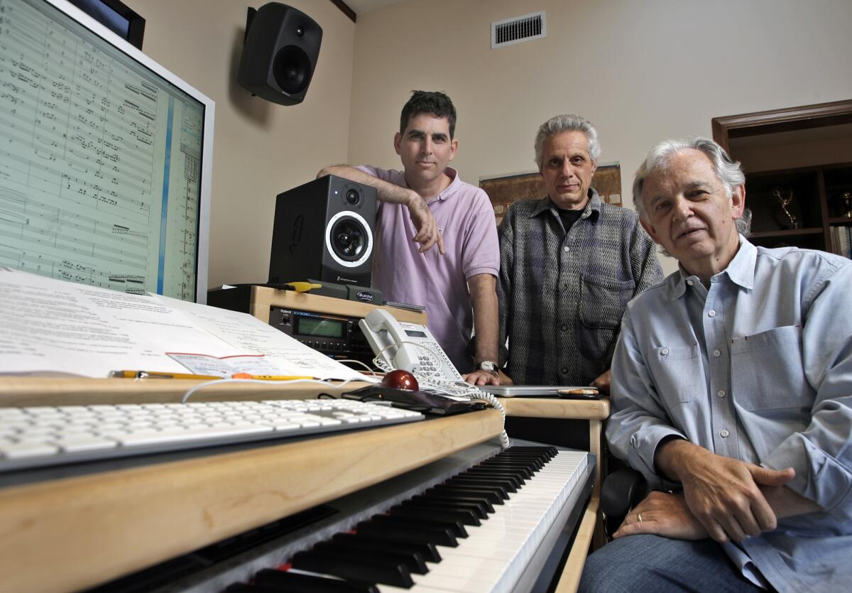 Bruce Broughton, right, James DiPasquale, center, and Alan Elliott take a break in Broughton's home studio. Broughton was stripped of an Oscar nomination earlier this year.