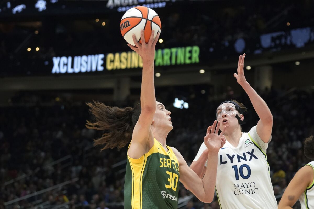 Seattle Storm forward Breanna Stewart (30) shoots against Minnesota Lynx forward Jessica Shepard (10) during the first half of a WNBA basketball game Wednesday, Aug. 3, 2022, in Seattle. (AP Photo/Ted S. Warren)