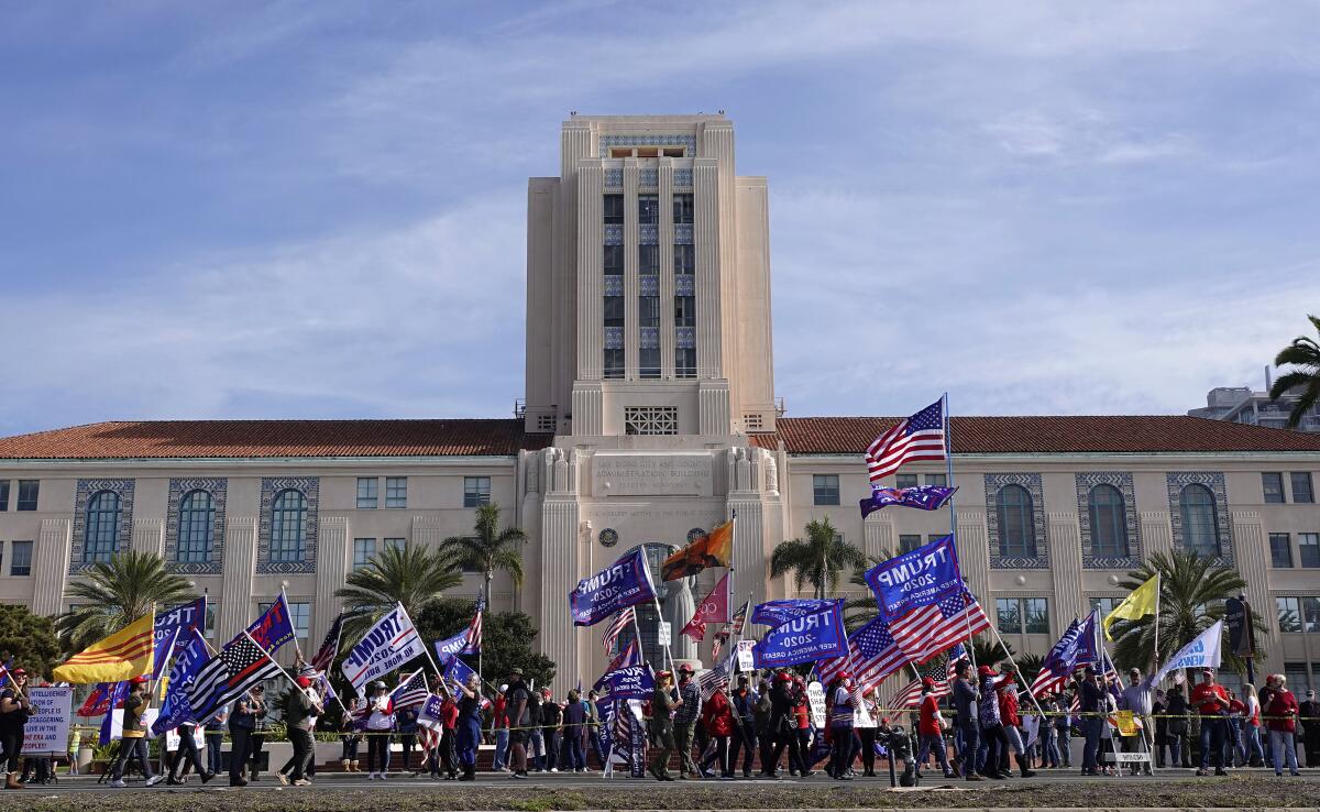 Trump supporters with Trump banners and U.S. flags gather for a rally in front of San Diego County Administration Building.