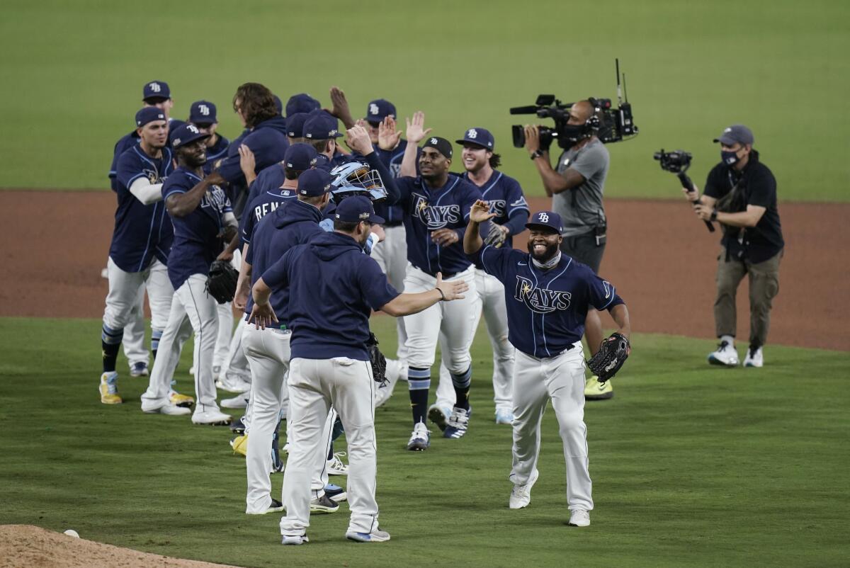 The Rays celebrate after defeating the Yankees 2-1 in Game 5 of the ALDS on Oct. 9, 2020.