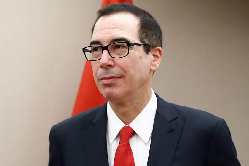 Treasury Secretary Steven Mnuchin arrives for a meeting, Friday, April 21, 2017, at the 2017 World Bank Group Spring Meetings in Washington. Mnuchin said in a brief statement that the administration "will not be issuing waivers to U.S. companies, including Exxon, authorizing drilling prohibited by current Russian sanctions." (AP Photo/Carolyn Kaster)