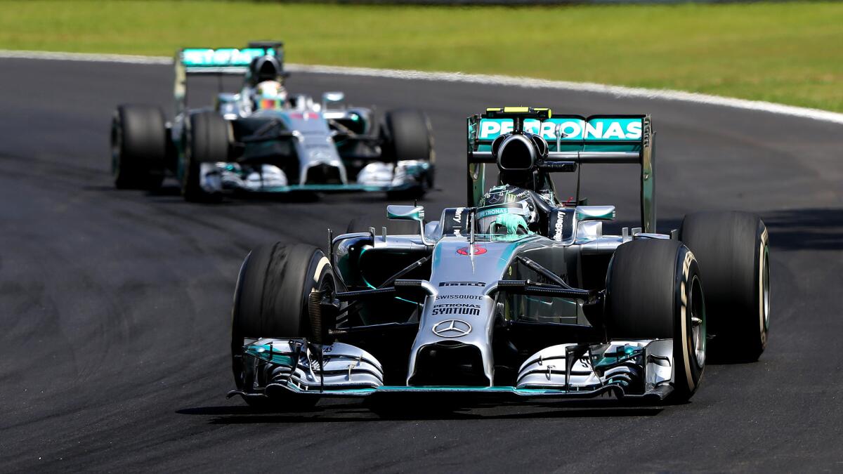 Nico Rosberg is followed by Mercedes teammate Lewis Hamilton during the Formula One Brazilian Grand Prix on Sunday.