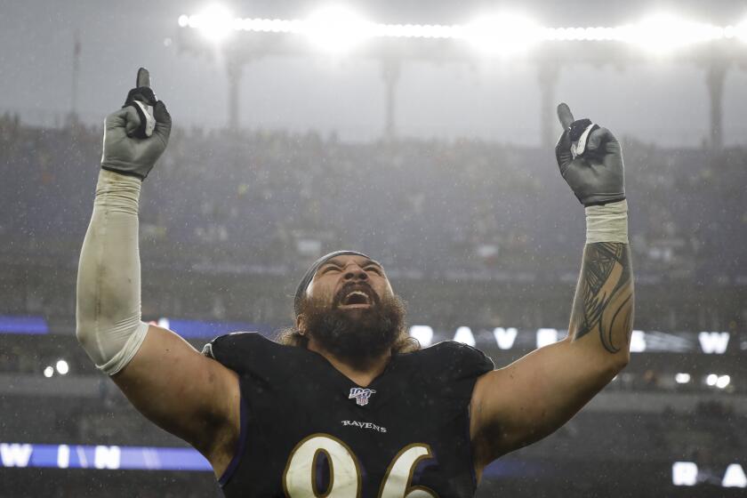 BALTIMORE, MD - DECEMBER 01: Domata Peko #96 of the Baltimore Ravens celebrates after the game against the San Francisco 49ers at M&T Bank Stadium on December 1, 2019 in Baltimore, Maryland. (Photo by Scott Taetsch/Getty Images)