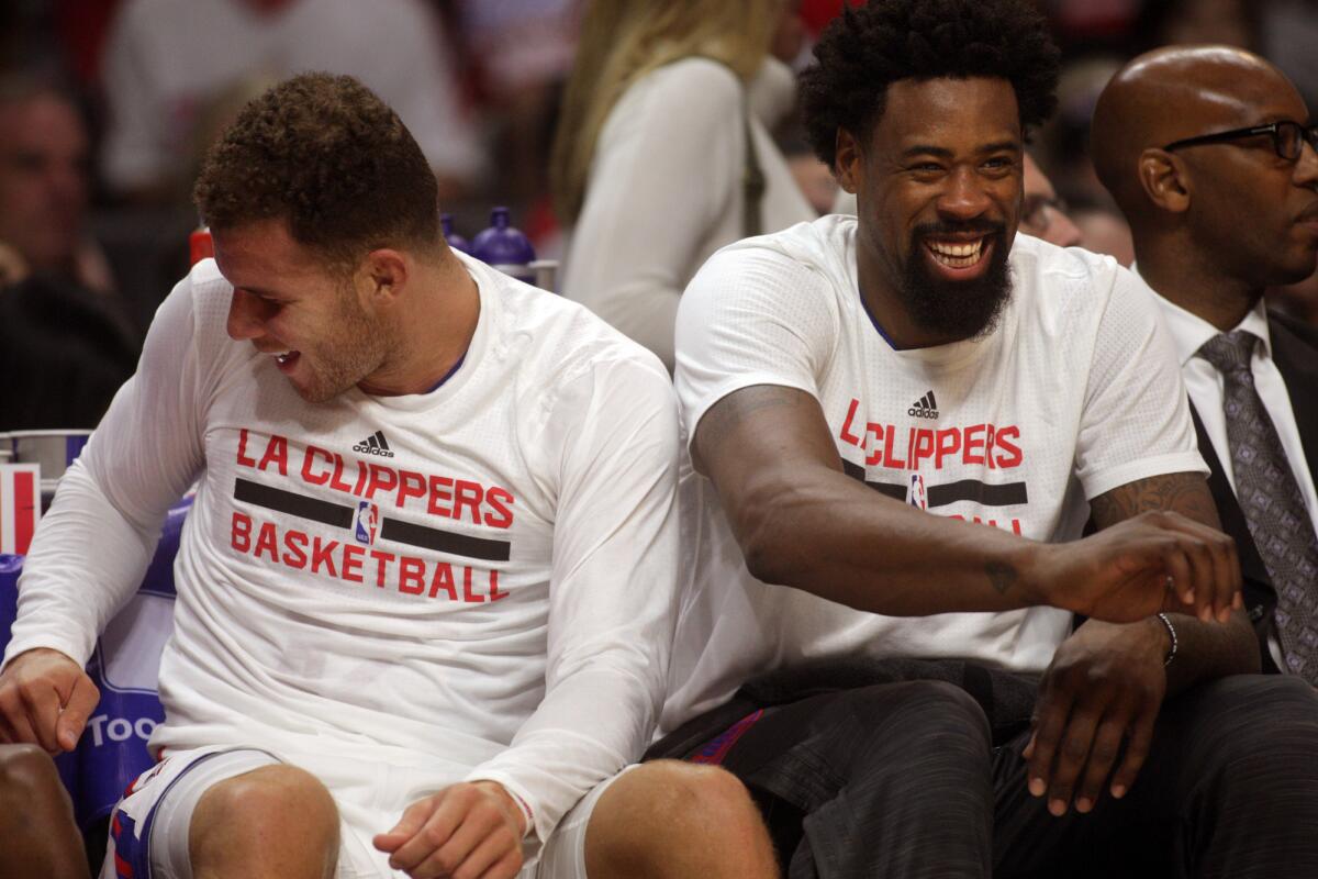 Blake Griffin, left, and DeAndre Jordan enjoy a light moment on the Clippers bench during a game against Sacramento on Oct. 29.