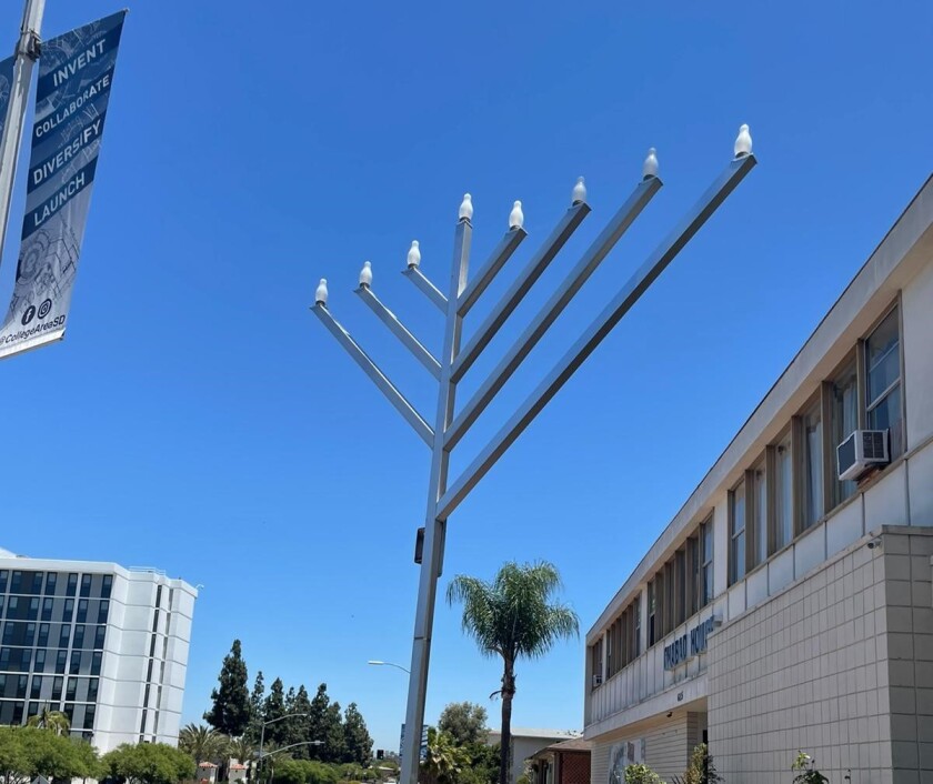 Vandals broke an arm off a menorah outside the Chabad House at San Diego State University.