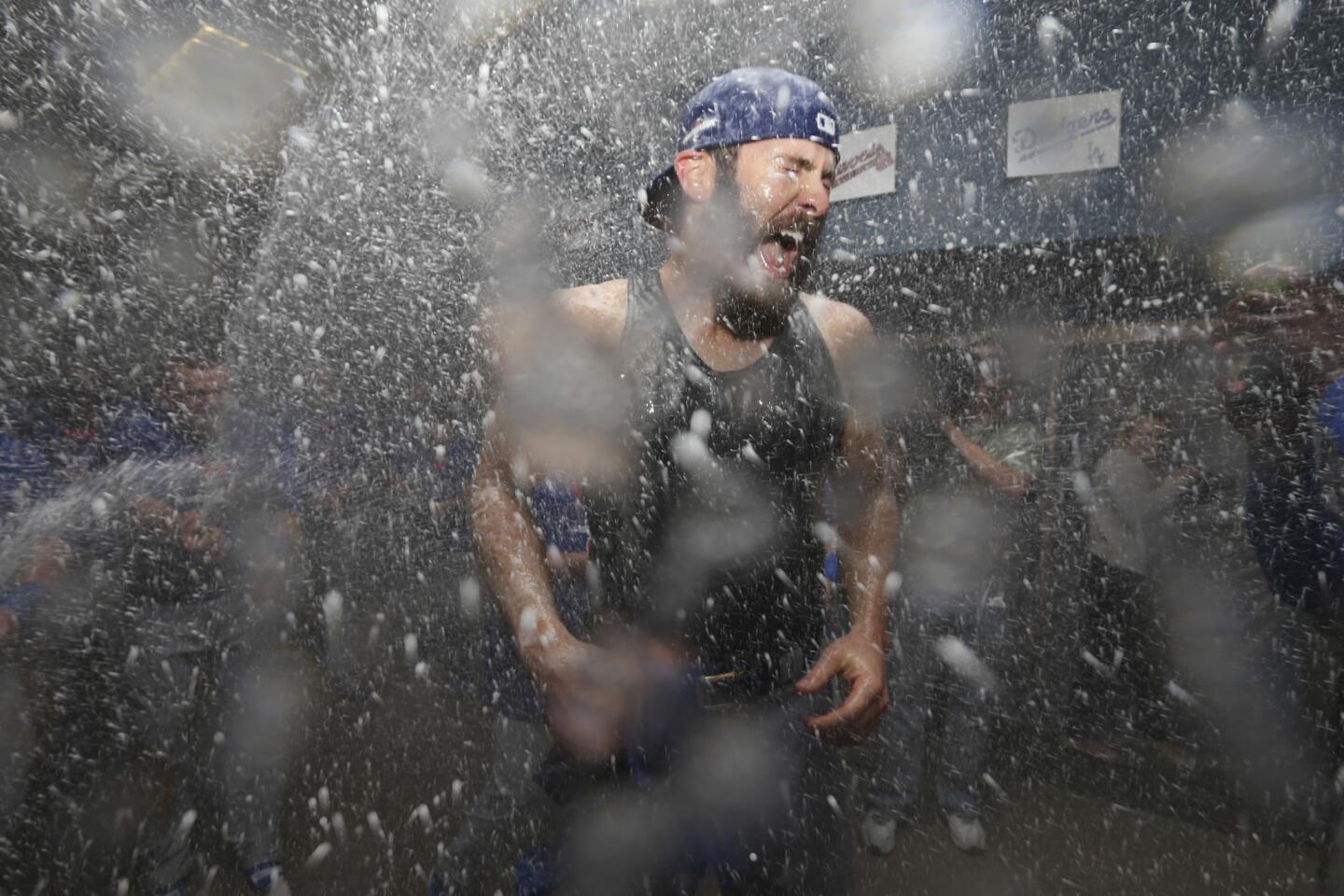 Cubs starting pitcher Jake Arrieta is doused with sparkling wine by teammates Oct. 7, 2015, after the Cubs beat the Pittsburgh Pirates in a wild-card game to advance to the National League Division Series.