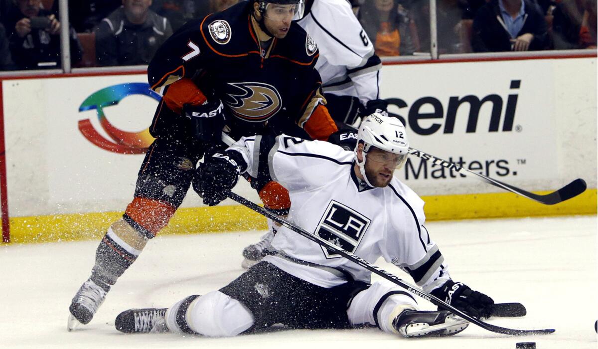 Kings right wing Marian Gaborik tries to clear the puck under pressure from Ducks center Andrew Cogliano in the first period Wednesday night.