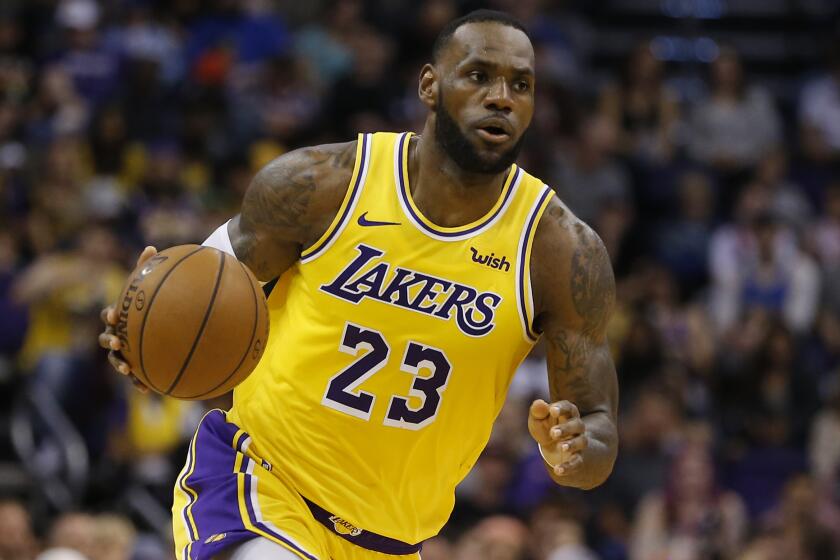 Los Angeles Lakers forward LeBron James controls the ball in the second half against the Phoenix Suns in Phoenix on March 2.