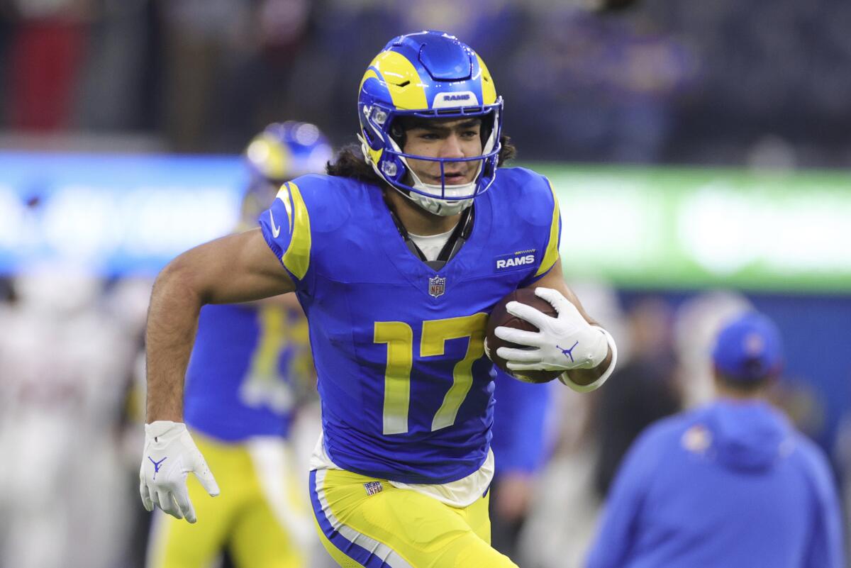 Los Angeles Rams wide receiver Puka Nacua warms up before an NFL football game.