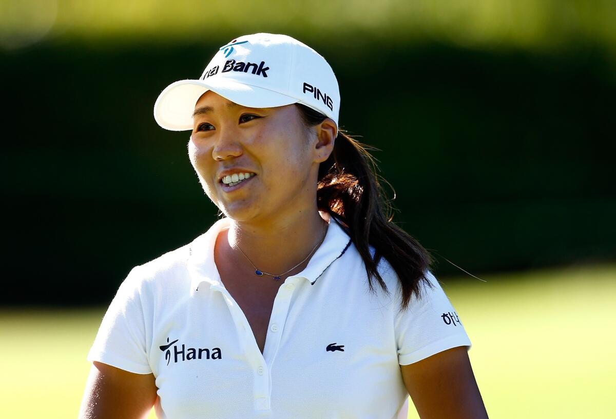 I.K. Kim of South Korea smiles after making birdie put on the 11th hole during the first round of the Portland Classic at the Columbia Edgewater Country Club.