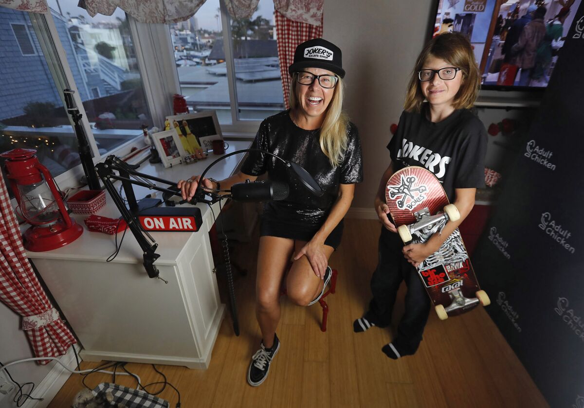 Newport Beach resident Nikki Chase with her 15-year-old son, Sandler, in her home studio.
