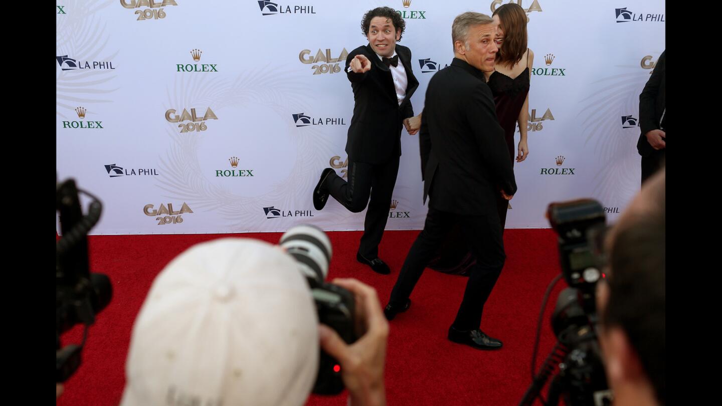 L.A. Phil conductor Gustavo Dudamel, left, has fun with actors Maria Valverde and Christoph Waltz on the red carpet during the Phil's opening night gala at Disney Hall on Tuesday.