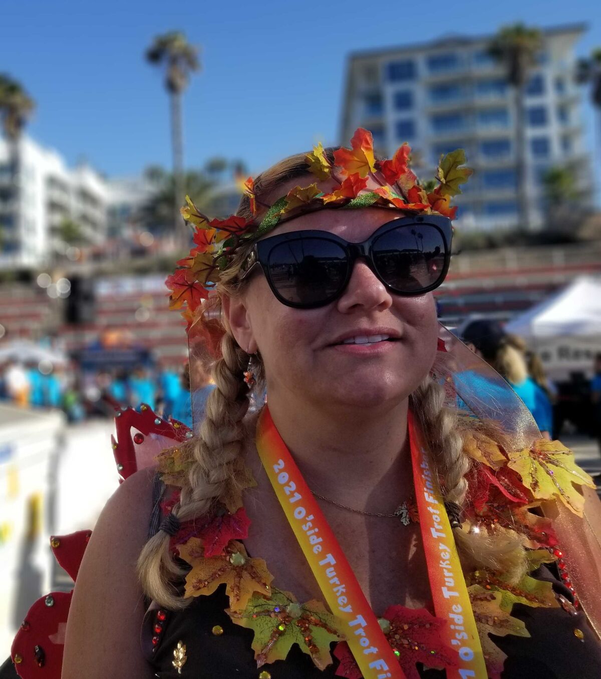 Breast cancer survivor Amy Autumn Brooker smiles after finishing the 2021 Oceanside Turkey Trot on Thanksgiving.