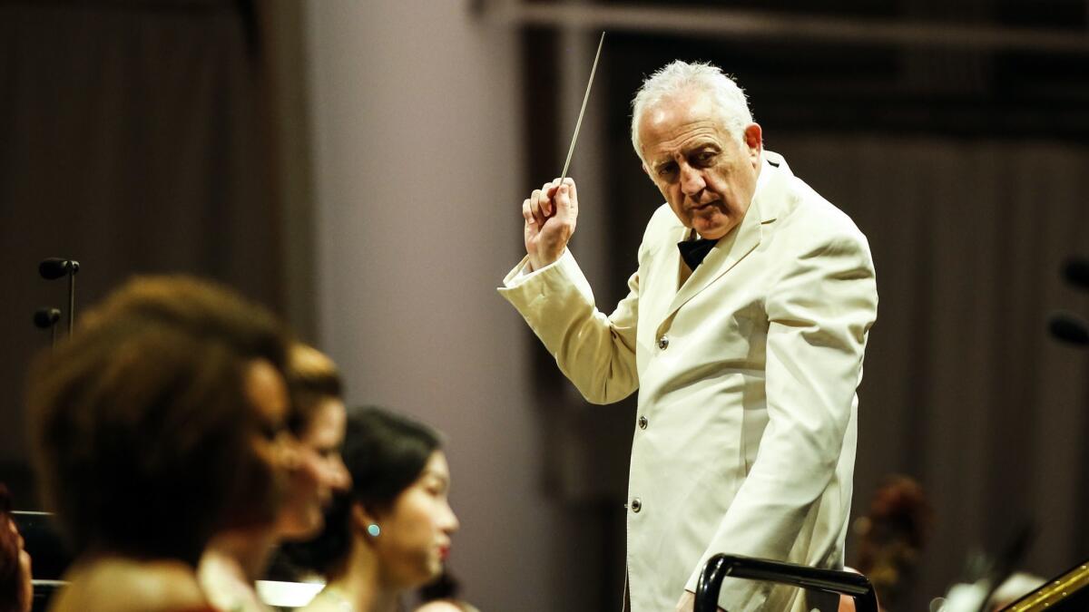 Bramwell Tovey conducts the Los Angeles Philharmonic through the popular "Carmina Burana" on Tuesday night at the Hollywood Bowl.