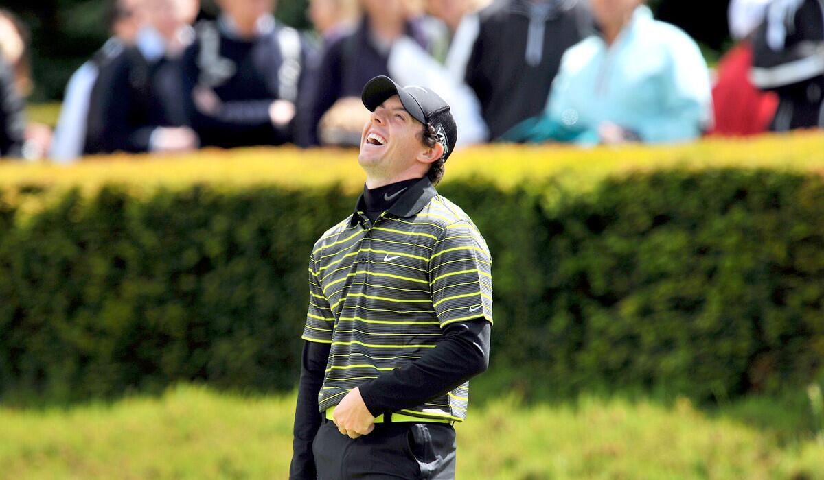 Rory McIlroy laughs while warming up on the putting green before the third round of the BMW PGA Championship at Wentworth Golf Club.
