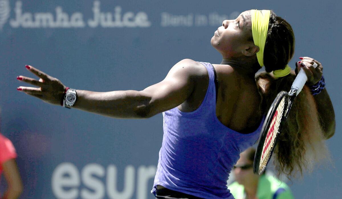 Serena Williams serves to Angelique Kerber during the championship match of the Bank of the West Classic on Sunday.