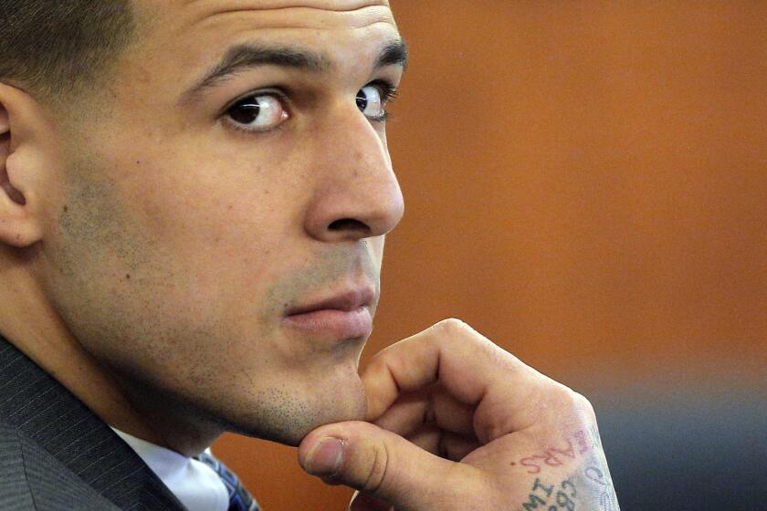 Former New England Patriots tight end Aaron Hernandez listens to testimony during his murder trial in Fall River, Mass., on April 1.