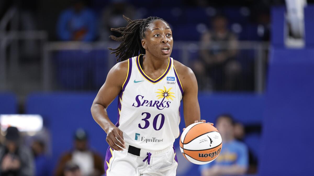 Sparks forward Nneka Ogwumike brings the ball up the court against the Chicago Sky during a game in May 2022.