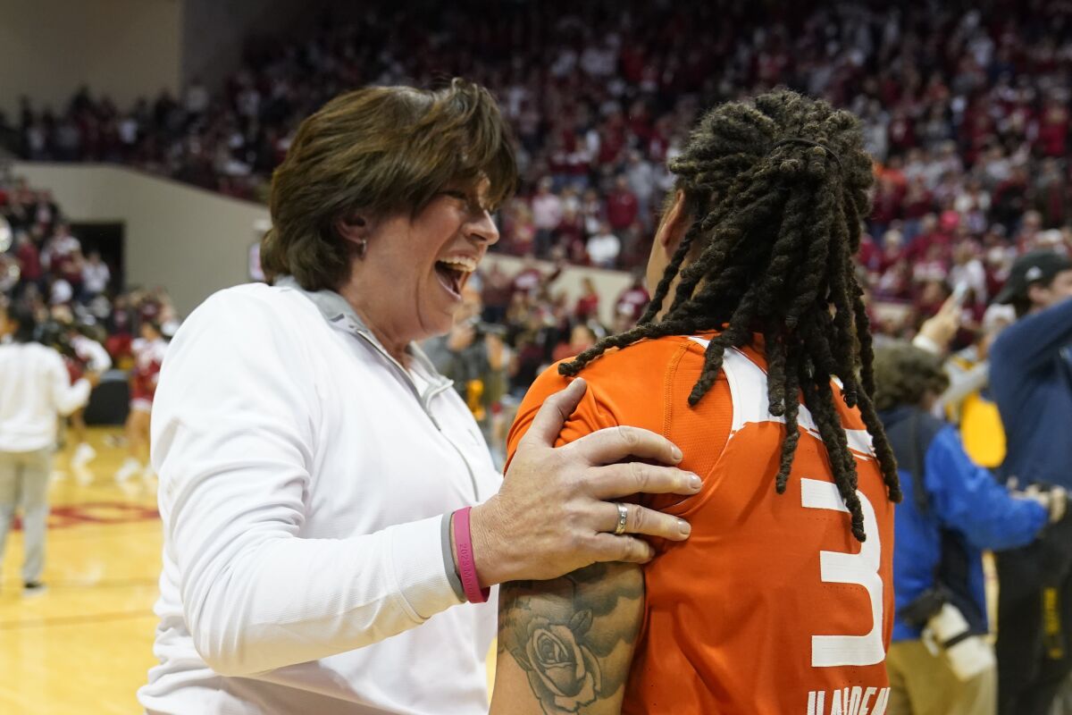 Miami head coach Katie Meier celebrates with Destiny Harden after Miami defeating Indiana in a second-round college basketball game in the women's NCAA Tournament Monday, March 20, 2023, in Bloomington, Ind. (AP Photo/Darron Cummings)