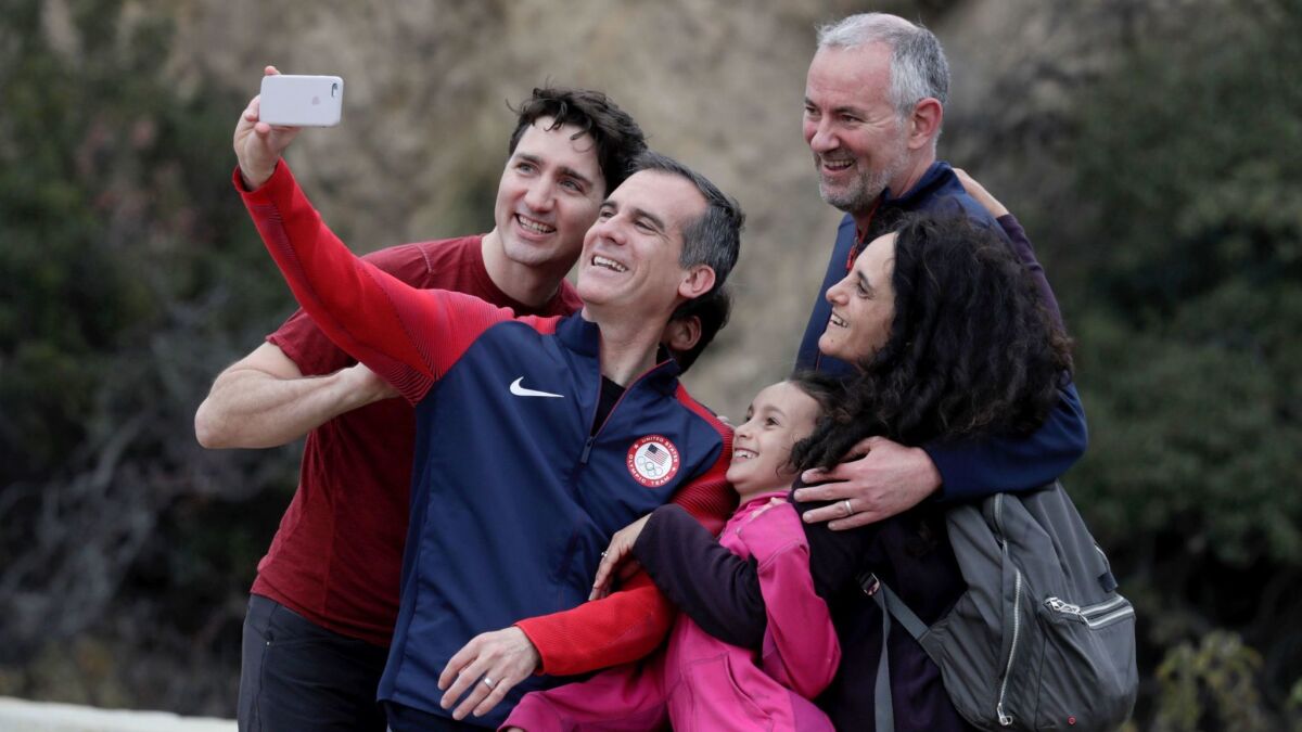 Mayor Eric Garcetti takes a selfie with Canadian Prime Minister Justin Trudeau, left, and Greg and Alexandria Dionne and their daughter Hazel.