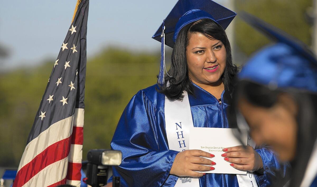 Clarisa Ortega waits to accept her diploma at her North Hollywood High graduation ceremony.