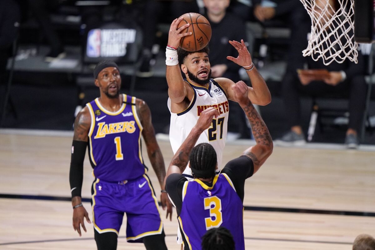 Nuggets guard Jamal Murray drives against Lakers forward Anthony Davis during Game 5.