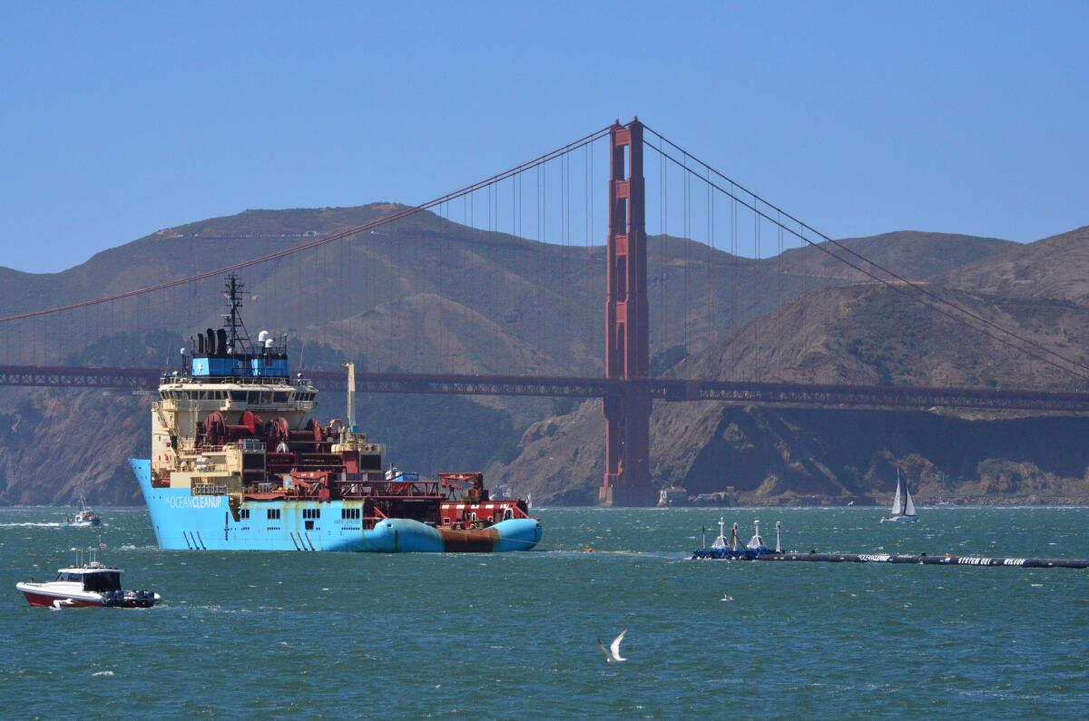 A ship in the San Francisco Bay in front of the Golden Gate Bridge. 