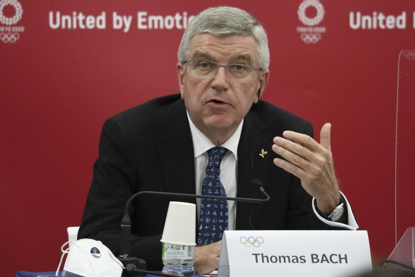 IOC president Thomas Bach speaks during a news conference on Nov. 16, 2020.
