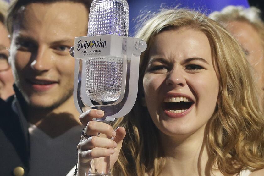 FILE - Then winner of the 2013 Eurovision Song Contest, Emmelie de Forest of Denmark, who won with her song 'Only Teardrops', holds the winners trophy as she poses for photographers following the final of the Eurovision Song Contest at the Malmo Arena in Malmo, Sweden, Saturday, May 18, 2013. Security will be tight during next month’s Eurovision Song Contest in southern Sweden. Pro-Palestinian activists who want Israel out of the contest, have announced large rallies in downtown Malmo, several kilometers (miles) from the contest venue. (AP Photo/Alastair Grant, File)