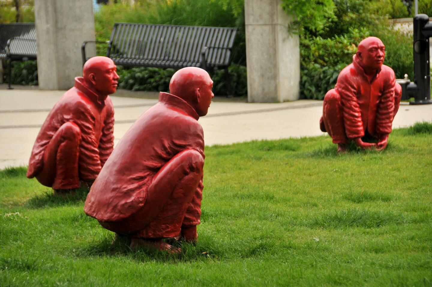 "The Meeting," a sculpture installation of a circle of men, is Chinese artist Wang Shugang's contribution to Vancouver, Canada's 2014-16 Biennale and is displayed in the suburb of North Vancouver.