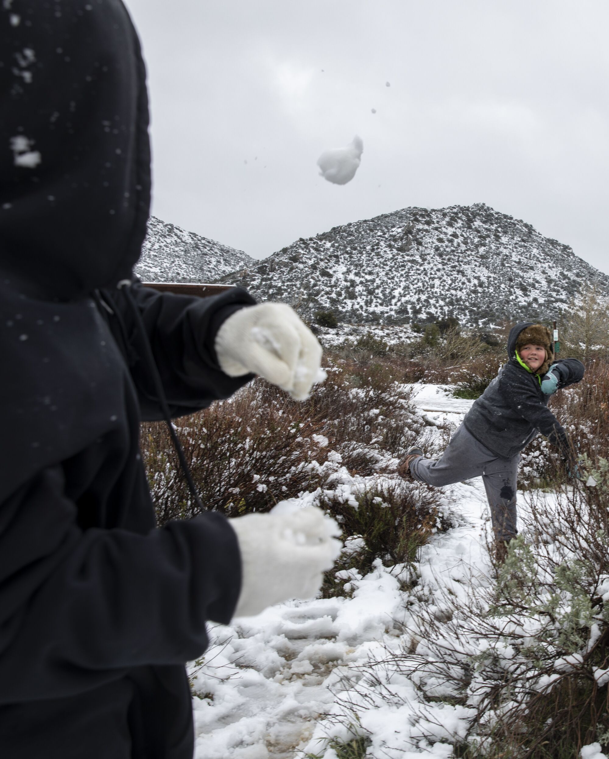 Kairo Ceballos Brylon Barcheers, of Yuma, play in the snow at a rest stop off of Interstate 8 near Pine Valley.