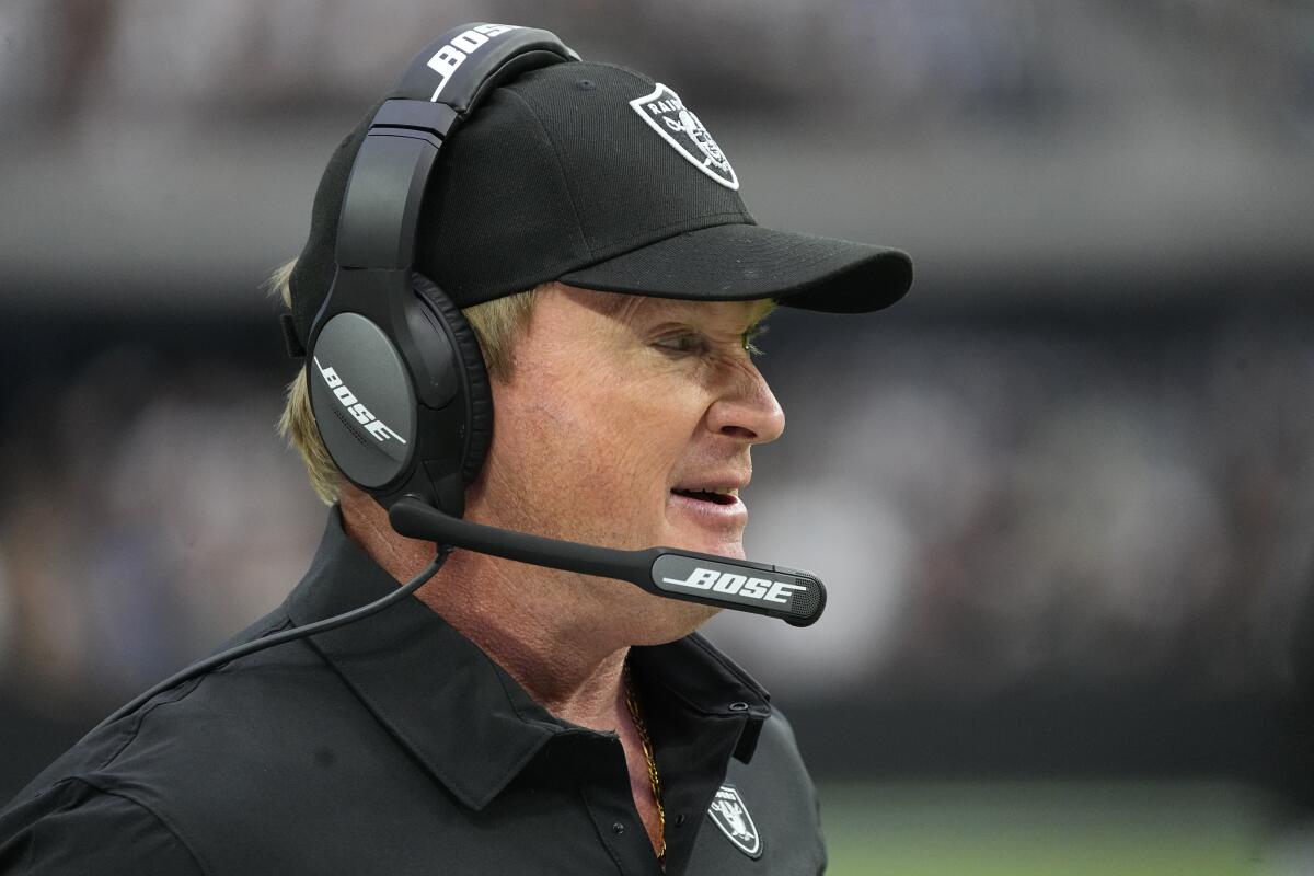 Las Vegas Raiders head coach Jon Gruden stands on the sidelines during the first half of an NFL football game against the Miami Dolphins, Sunday, Sept. 26, 2021, in Las Vegas. (AP Photo/Rick Scuteri)