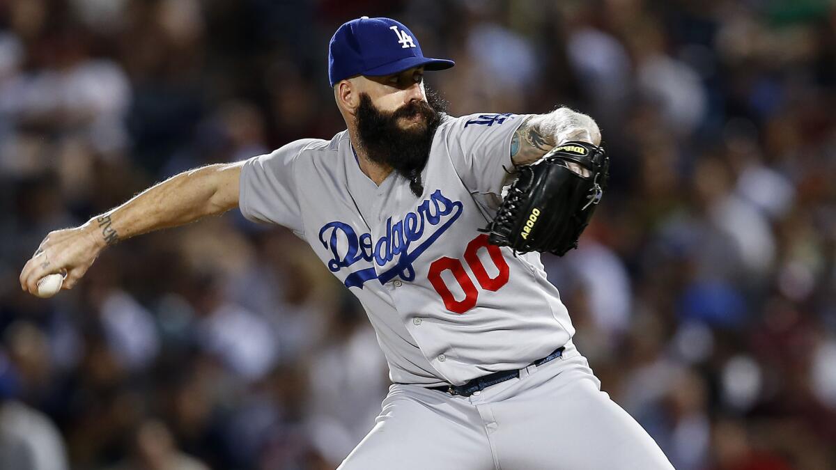 Dodgers reliever Brian Wilson pitches during the team's 4-2 victory over the Atlanta Braves on Tuesday.