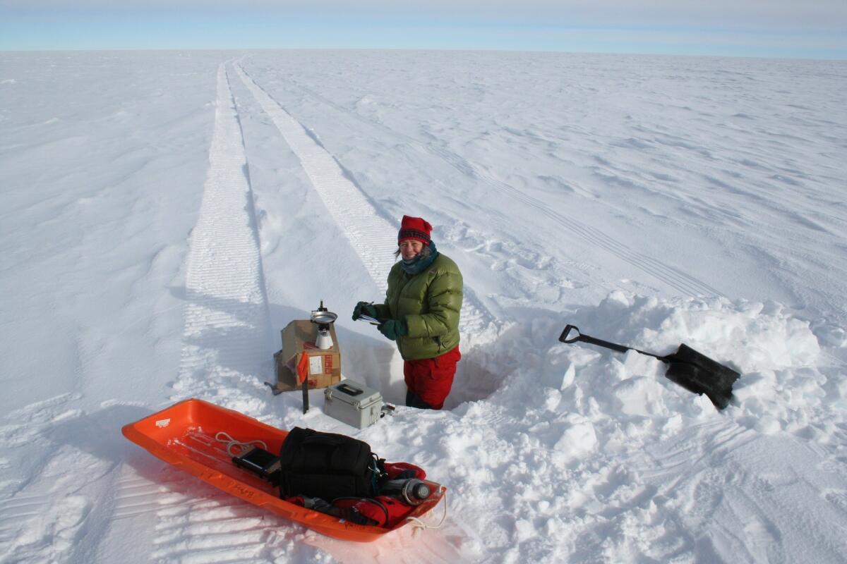 In an image provided by the Norwegian Polar Institute, ice core driller Lou Albershardt of the Norwegian-American Scientific Traverse of East Antarctica is seen in Antarctica.